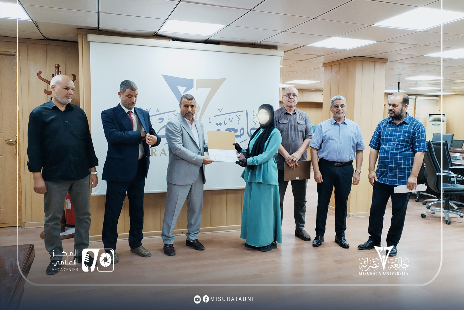 Misurata University: Two students honored for their excellence in the Fine Arts Competition.
                     width=